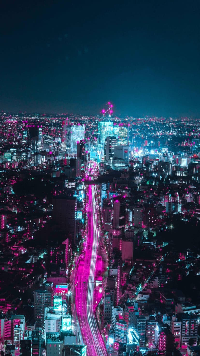 Glowing pink highway light trails cut through a blue neon Tokyo cityscape in this vertical urban scene.