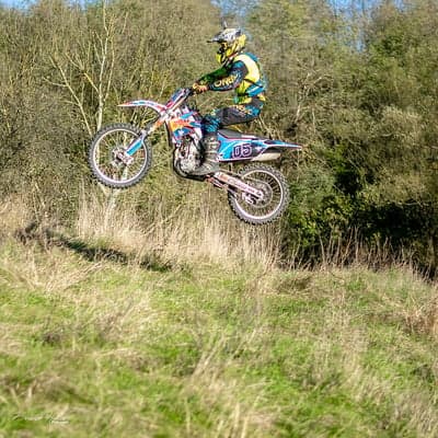 Extreme Motocross Rider Mid-Air Stunt Mobile Wallpaper