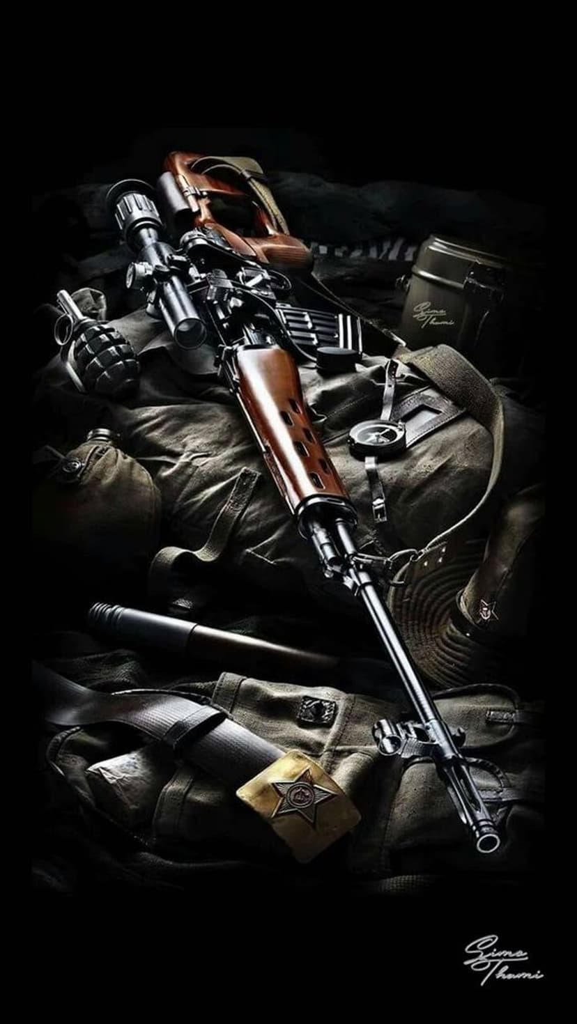 Scoped sniper rifle, olive drab canteen, and hand grenade arranged on a textured canvas surface in low light.