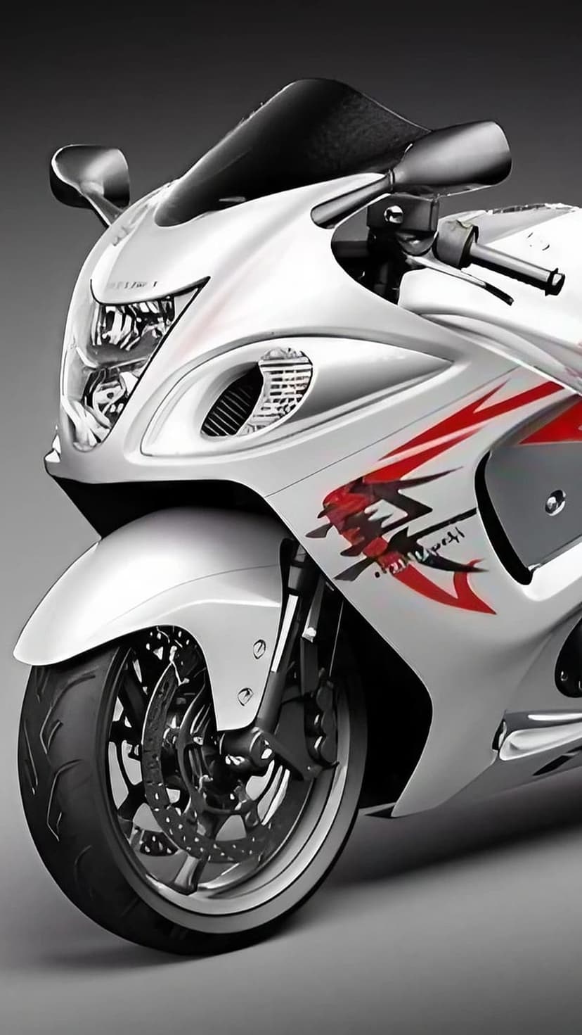 White Suzuki Hayabusa motorcycle showcasing dual headlights and aerodynamic fairing against a grey background.