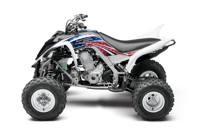 Yamaha Raptor 700 ATV with patriotic red white and blue graphics on a clean white studio background.