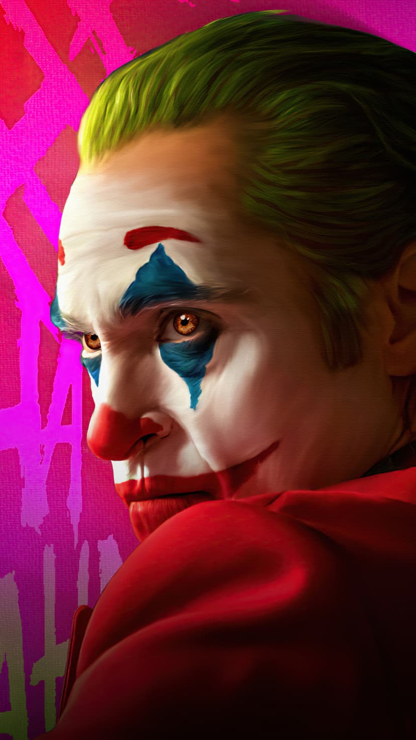 Joaquin Phoenix as Joker with smeared clown makeup and green hair against a pink graffiti-covered wall backdrop.