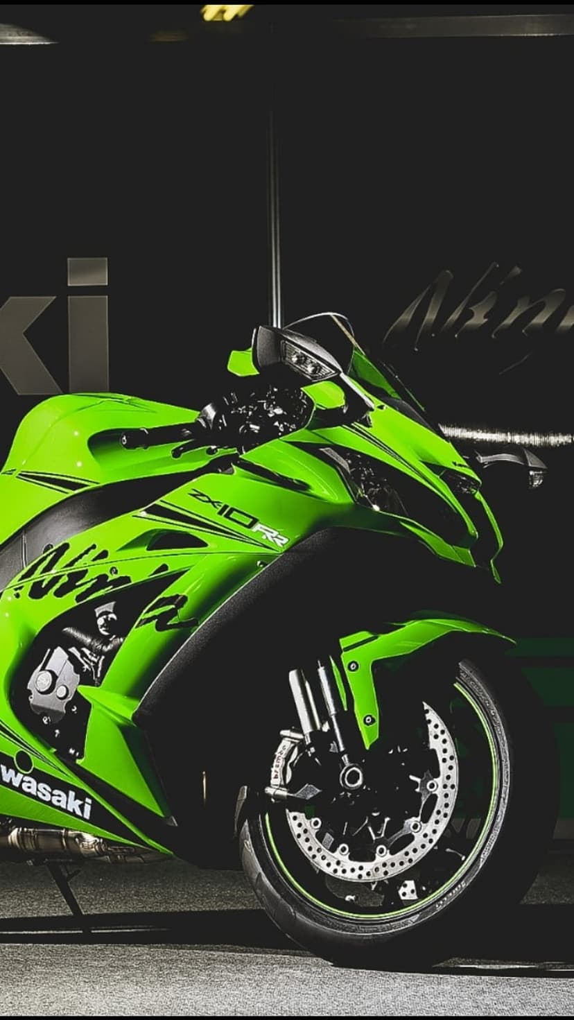 Kawasaki Ninja ZX-10RR superbike with lime green fairings and aggressive front headlights in a vertical view.