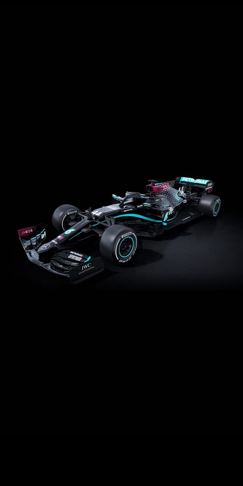 Mercedes F1 racing car with black livery and turquoise accents on a dark background showing aerodynamic details.