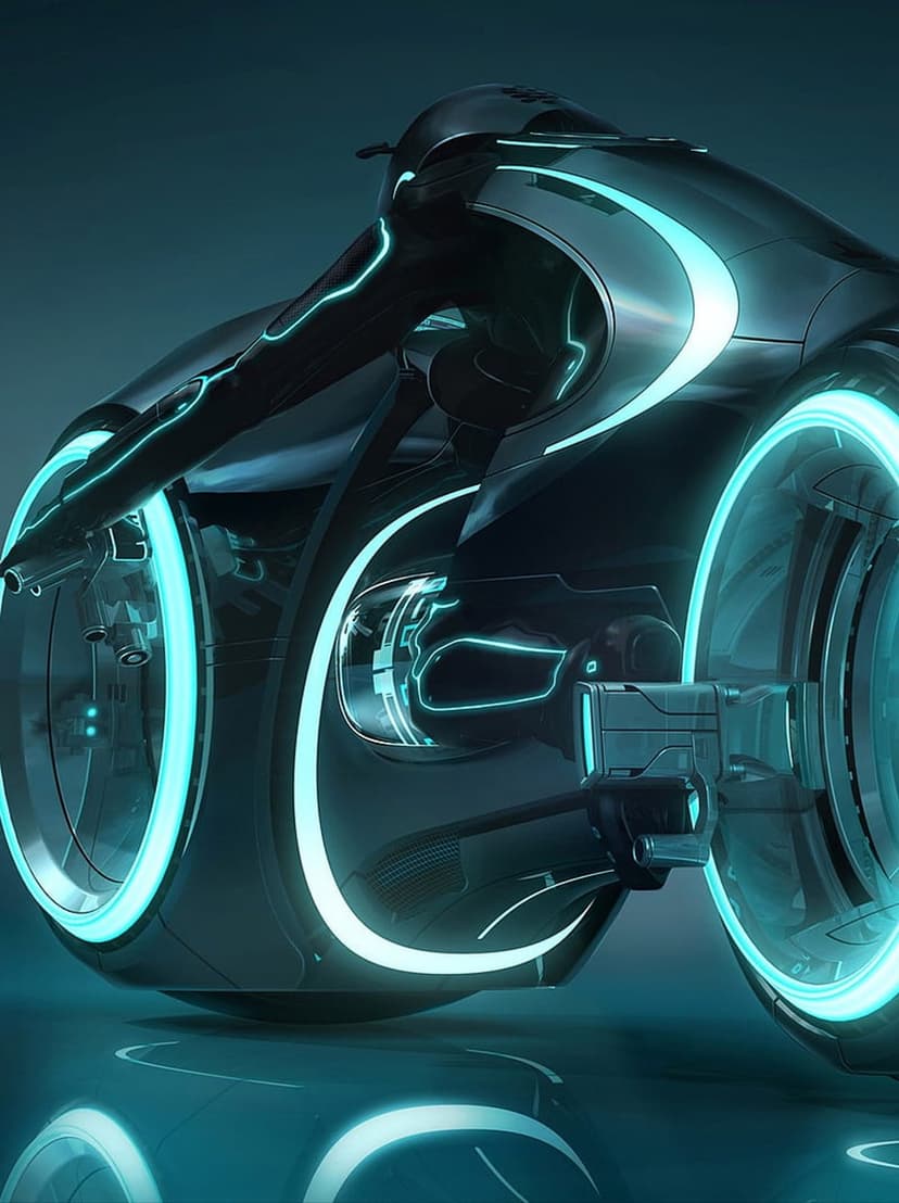 Futuristic black motorcycle with glowing blue rims and neon accents reflecting on a polished dark ground.