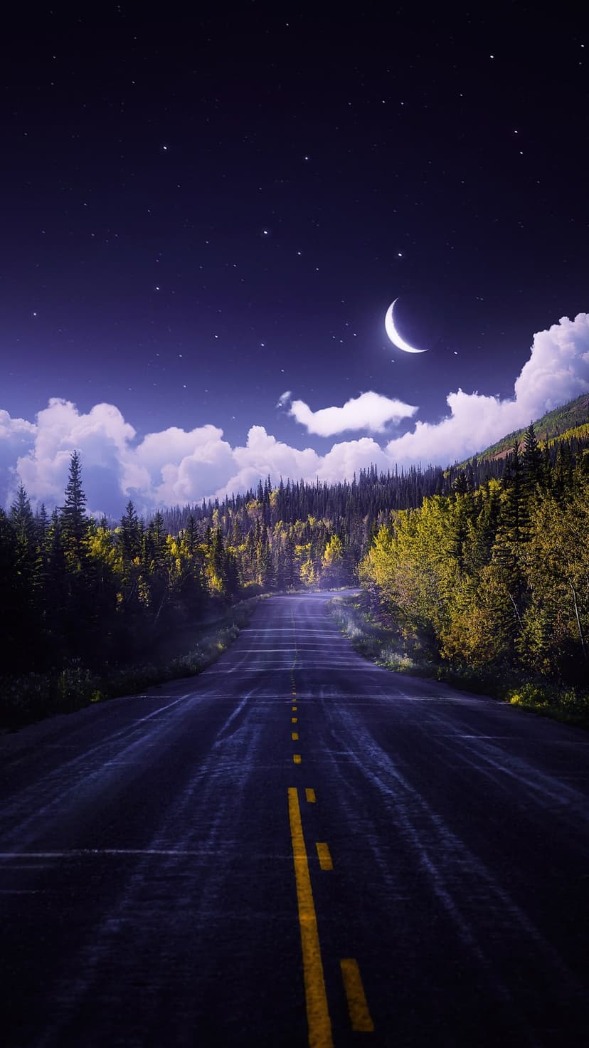 Dark asphalt highway winds through glowing orange autumn trees beneath a crescent moon and starry night sky.