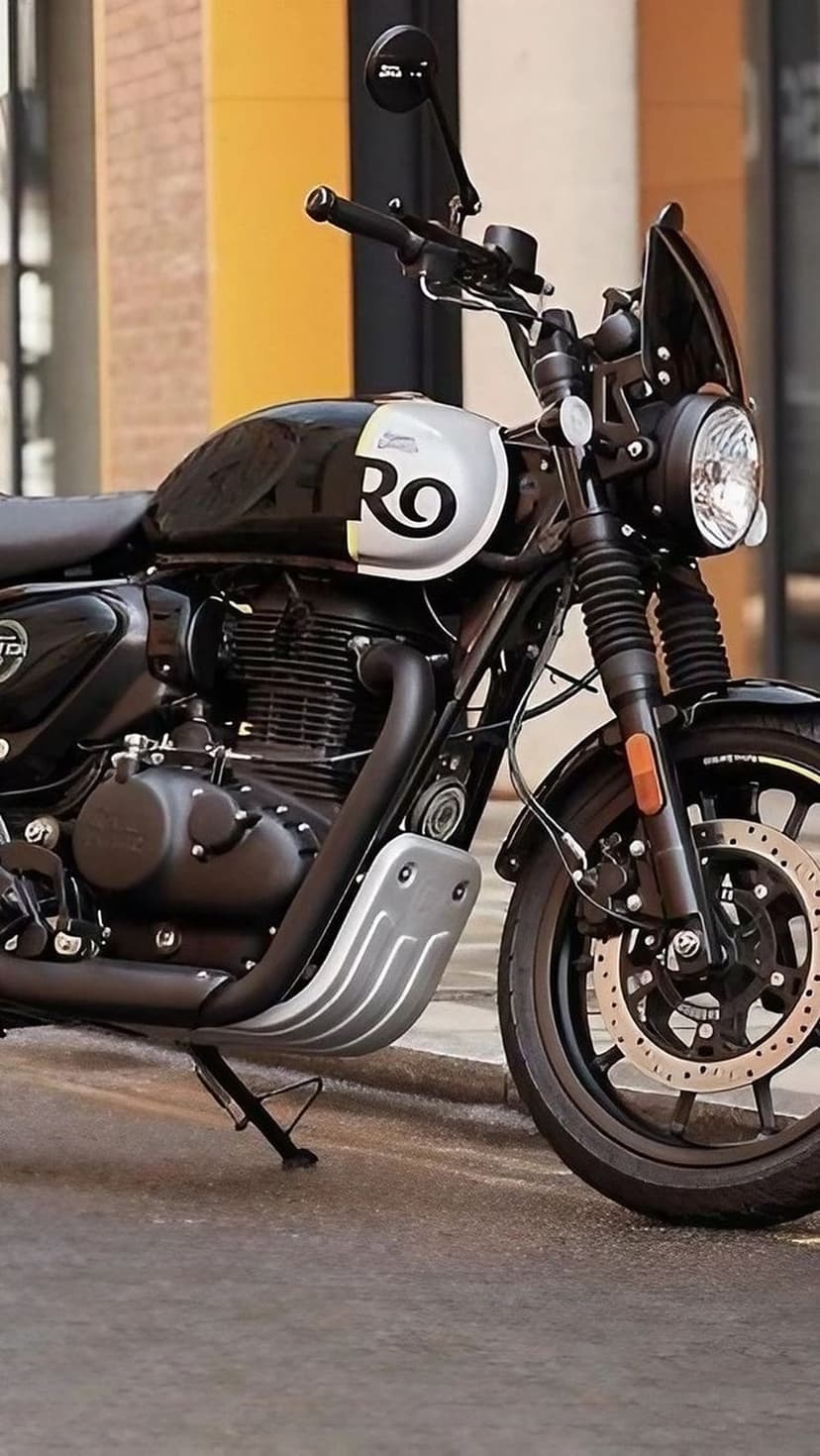 Royal Enfield Hunter 350 motorcycle with a chrome exhaust and silver tank logo parked on a wet street.