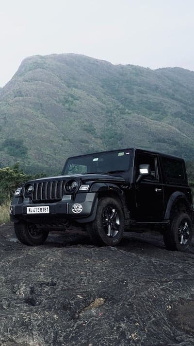 Black Jeep Thar on Rocky Mountain Terrain