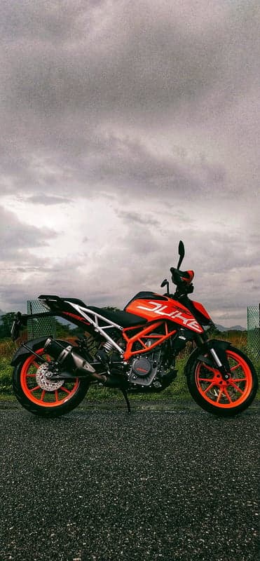 Orange KTM Duke Motorcycle on Asphalt Road