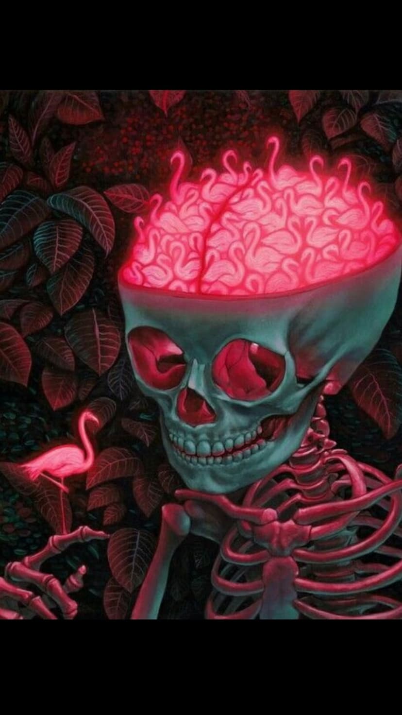 Human skull containing a brain made of pink flamingos rests amidst dark tropical leaves and a standing bird.