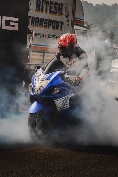 Motorcyclist Performs Burnout with Blue Suzuki Hayabusa