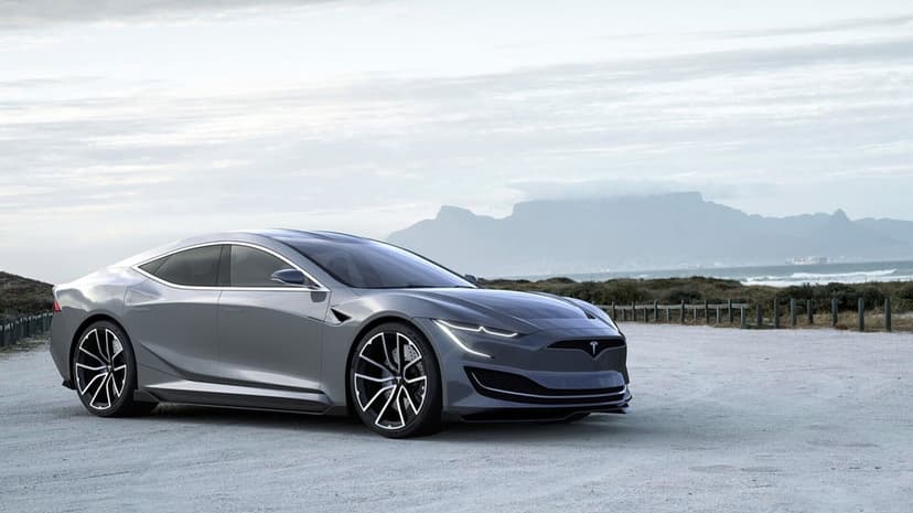 Silver Tesla sports car on a white sandy beach with Table Mountain and the ocean under an overcast sky.