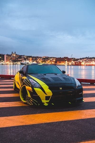 Yellow and Black Nissan GT-R City Skyline Mobile Background