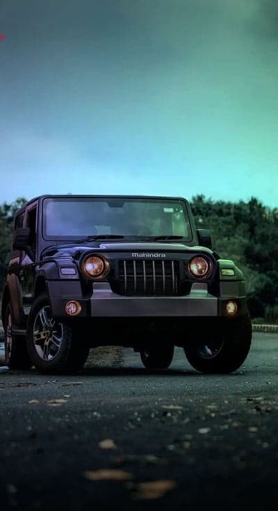 Rugged Black Mahindra Thar 4x4 SUV Portrait Background