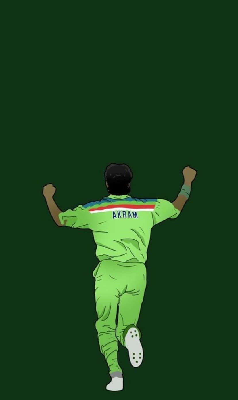 Wasim Akram raises his arms in a victory pose wearing a green Pakistan jersey with AKRAM written on the back.