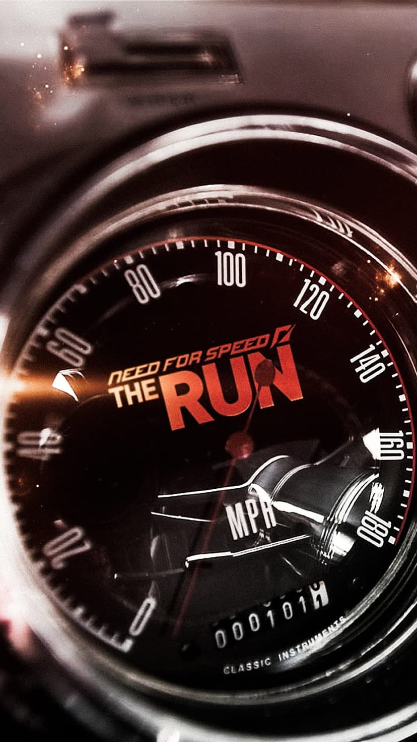 Vintage car speedometer with a glowing orange logo and a needle indicating high speed on a dark dashboard.