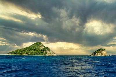 Dramatic Stormy Skies Over Lush Tropical Islands