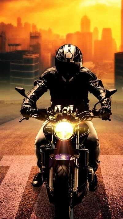 Urban Motorcyclist Sunset Cityscape Phone Wallpaper