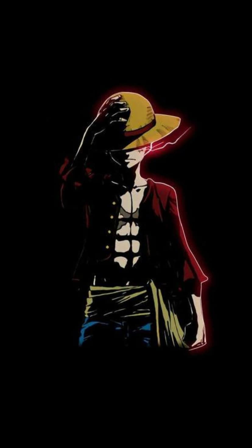 Monkey D. Luffy clutches his straw hat while surrounded by a radiant red energy aura on a solid black background.
