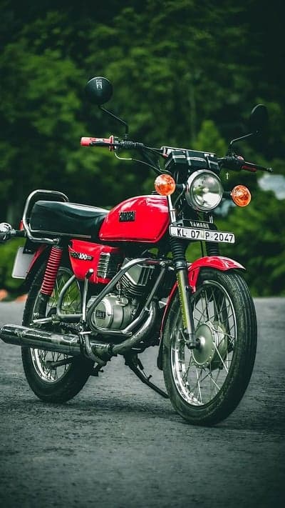Vintage Red Yamaha RX 100 Motorcycle Outdoors