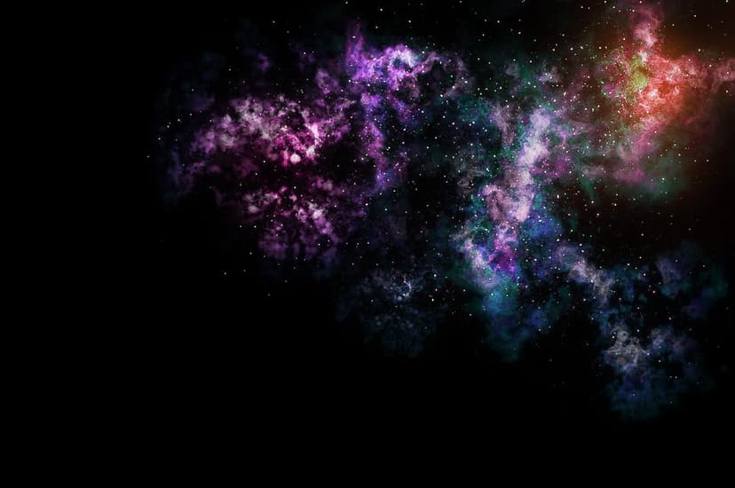 Multicolored purple and green nebula clouds swirl around small white stars against a black cosmic background.