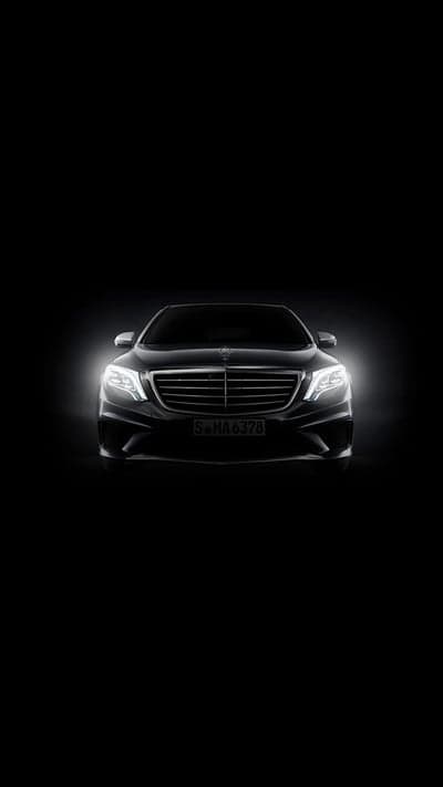 Dark Luxury Mercedes S-Class Headlights Illuminated