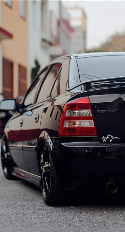 Black Opel Astra GTC rear view street photography