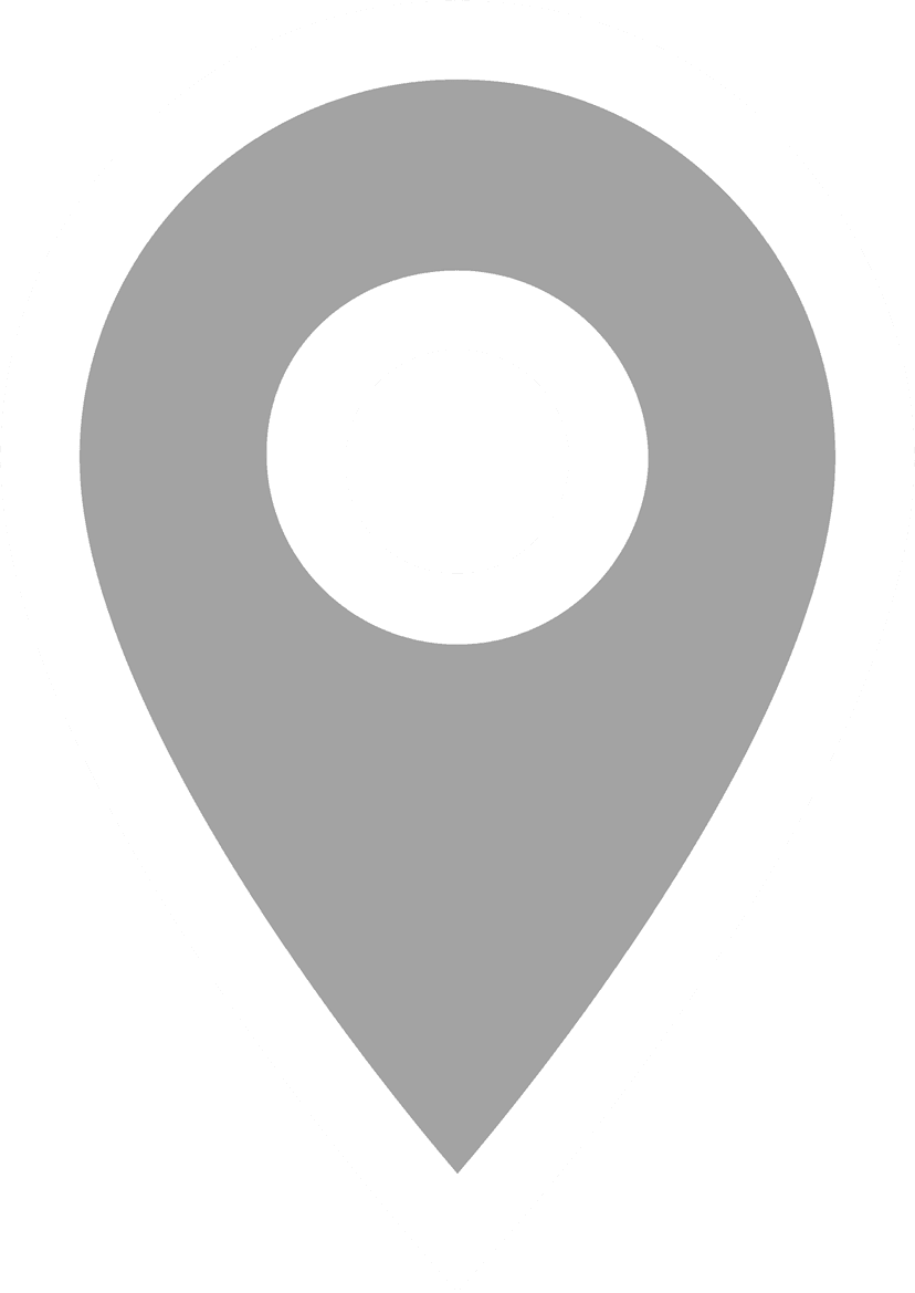 Gray location marker pin featuring a sharp teardrop silhouette and a circular white cutout at the center.