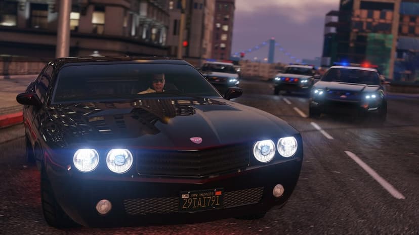 Black muscle car leads a high-speed police chase through city streets at dusk with flashing sirens.