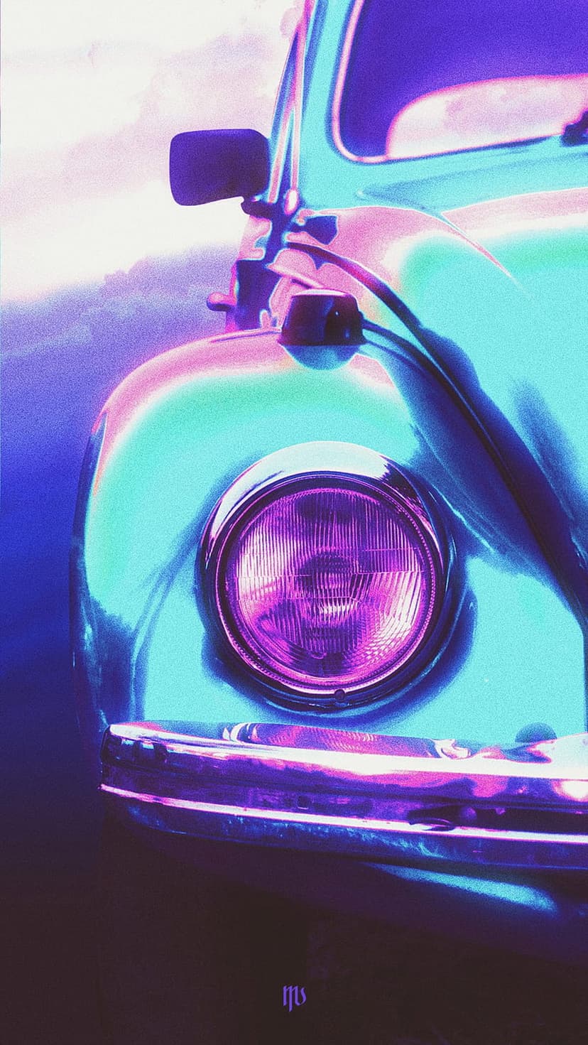 Round Volkswagen Beetle headlight reflects neon pink and teal lights against a dark metallic fender.
