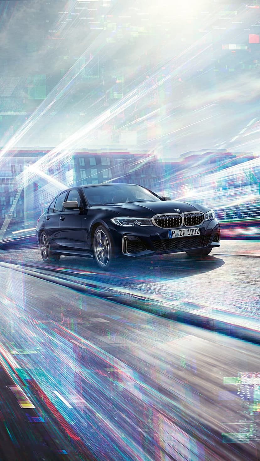 Black BMW 3 Series sedan speeds through a futuristic urban night with neon light trails and digital effects.