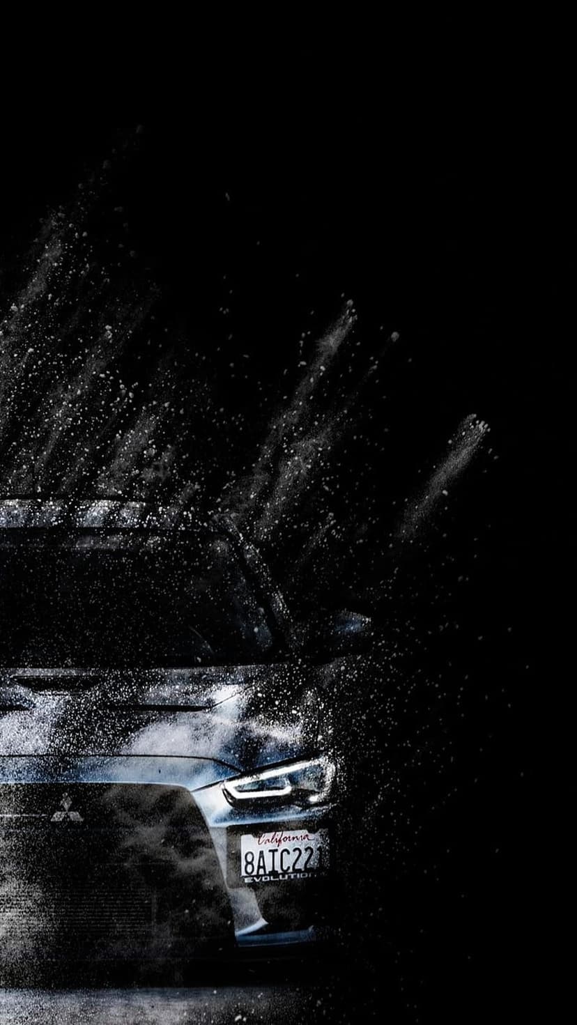 Rear car taillights glowing red amidst a cinematic white powder burst against a dark vertical background.
