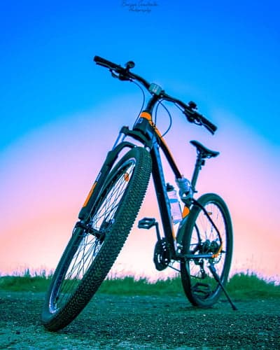 Vibrant Sunset Mountain Bike Trail Mobile Wallpaper