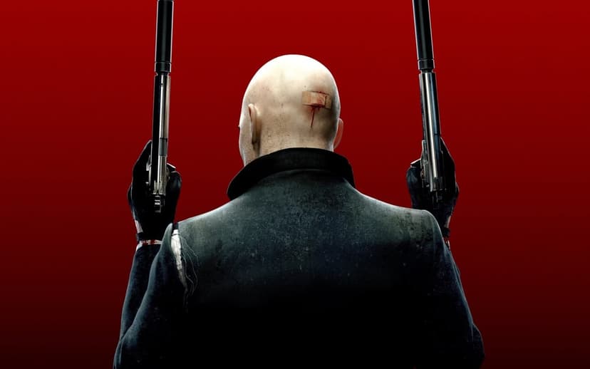 Agent 47 from behind holding dual silenced pistols against a solid red background with a bandage on his head.