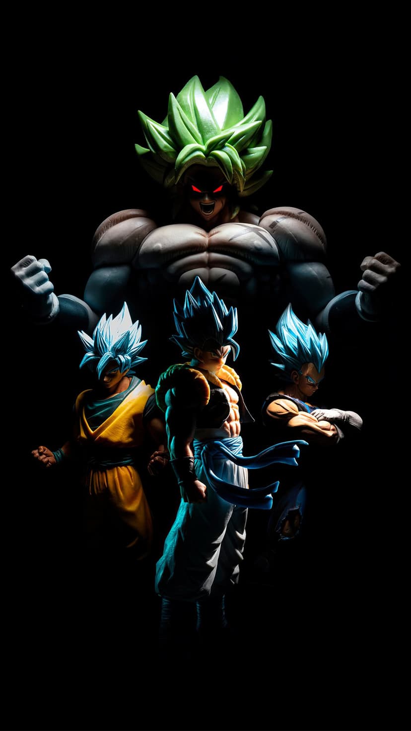 Broly with green hair and red eyes towers over Gogeta, Goku, and Vegeta amidst dramatic shadows and blue glows.