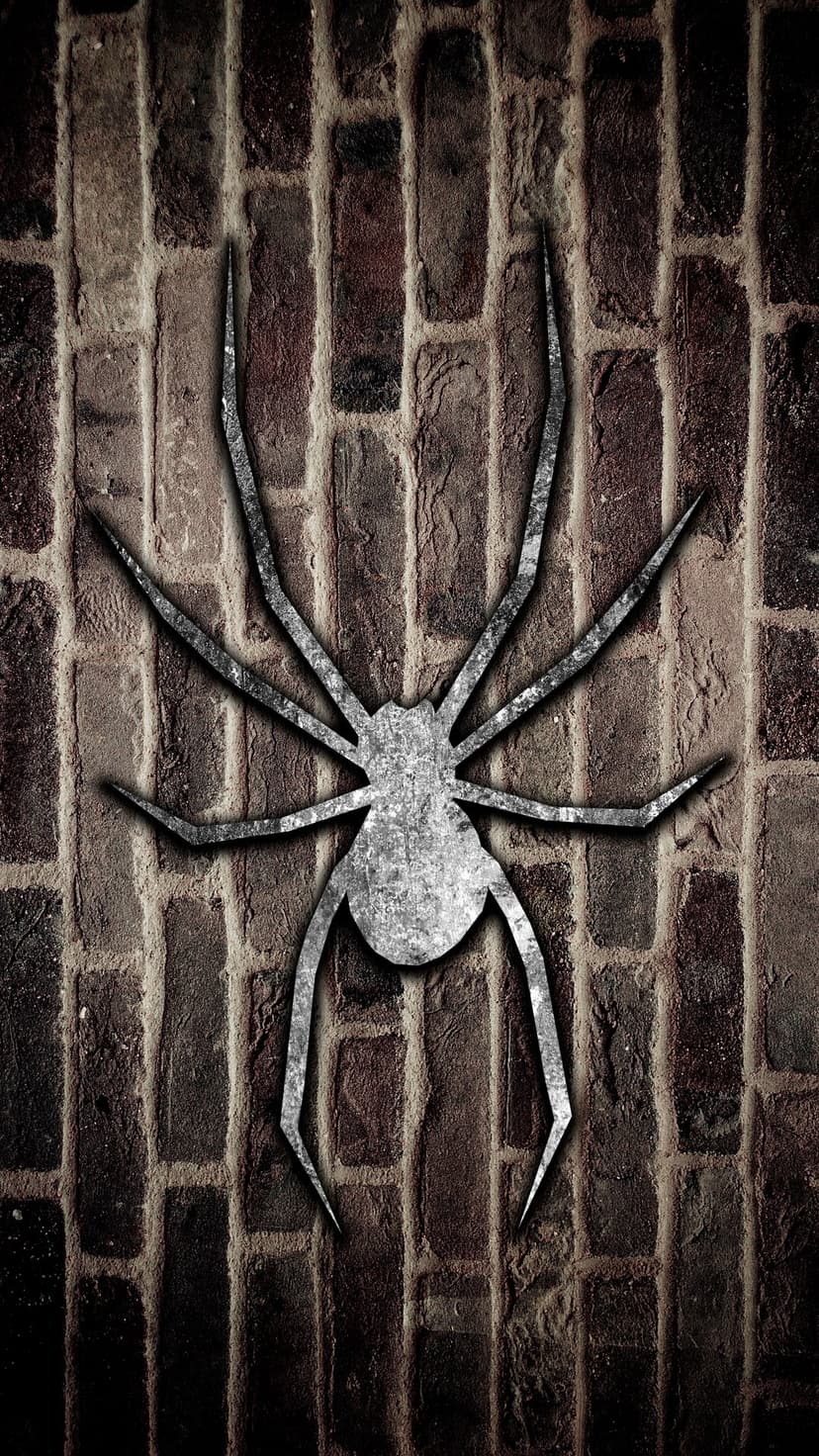 Metallic spider emblem centered on a dark rustic brick wall with weathered textures and moody shadows.