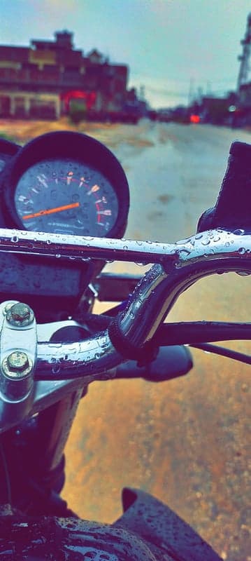 Moody Rainy Day Motorcycle Handlebars Mobile Background
