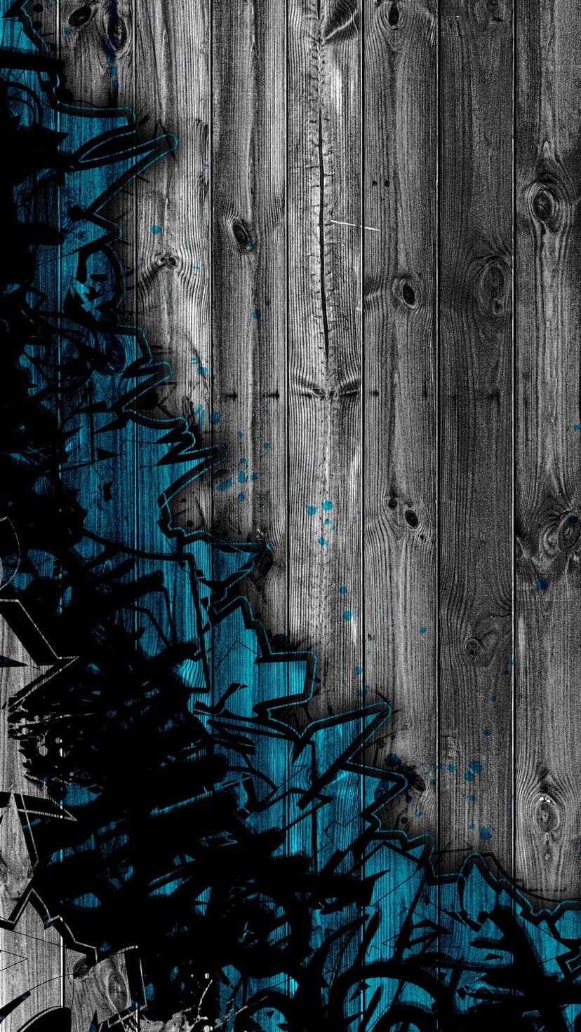 Teal and black graffiti splashes over vertical weathered gray wooden planks with detailed grain textures.