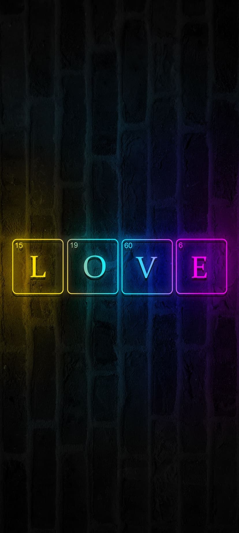 Four neon periodic table squares spelling love glow with pink and white light on a dark textured brick wall.