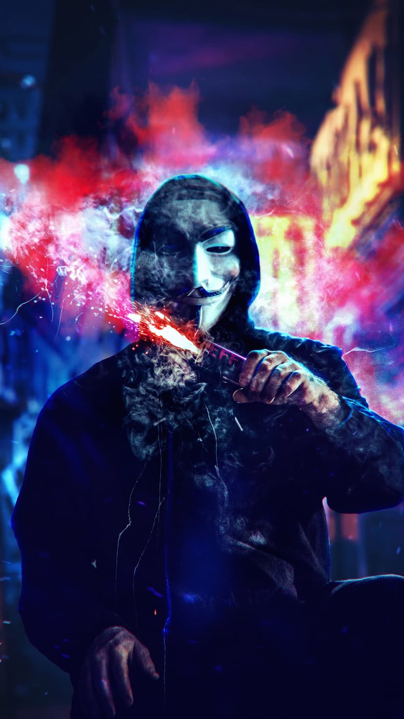 Masked figure in a hoodie holding a device emitting bright orange sparks and smoke against a blurred city night.
