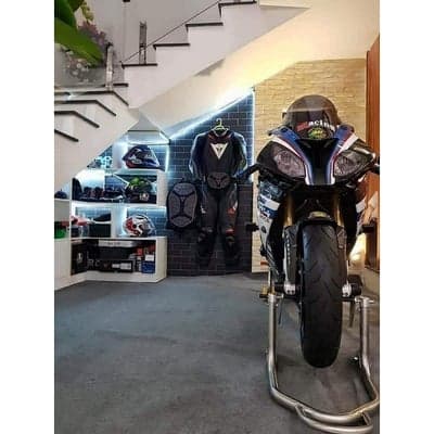 Motorcycle Gear and Bike Display Under Stairs