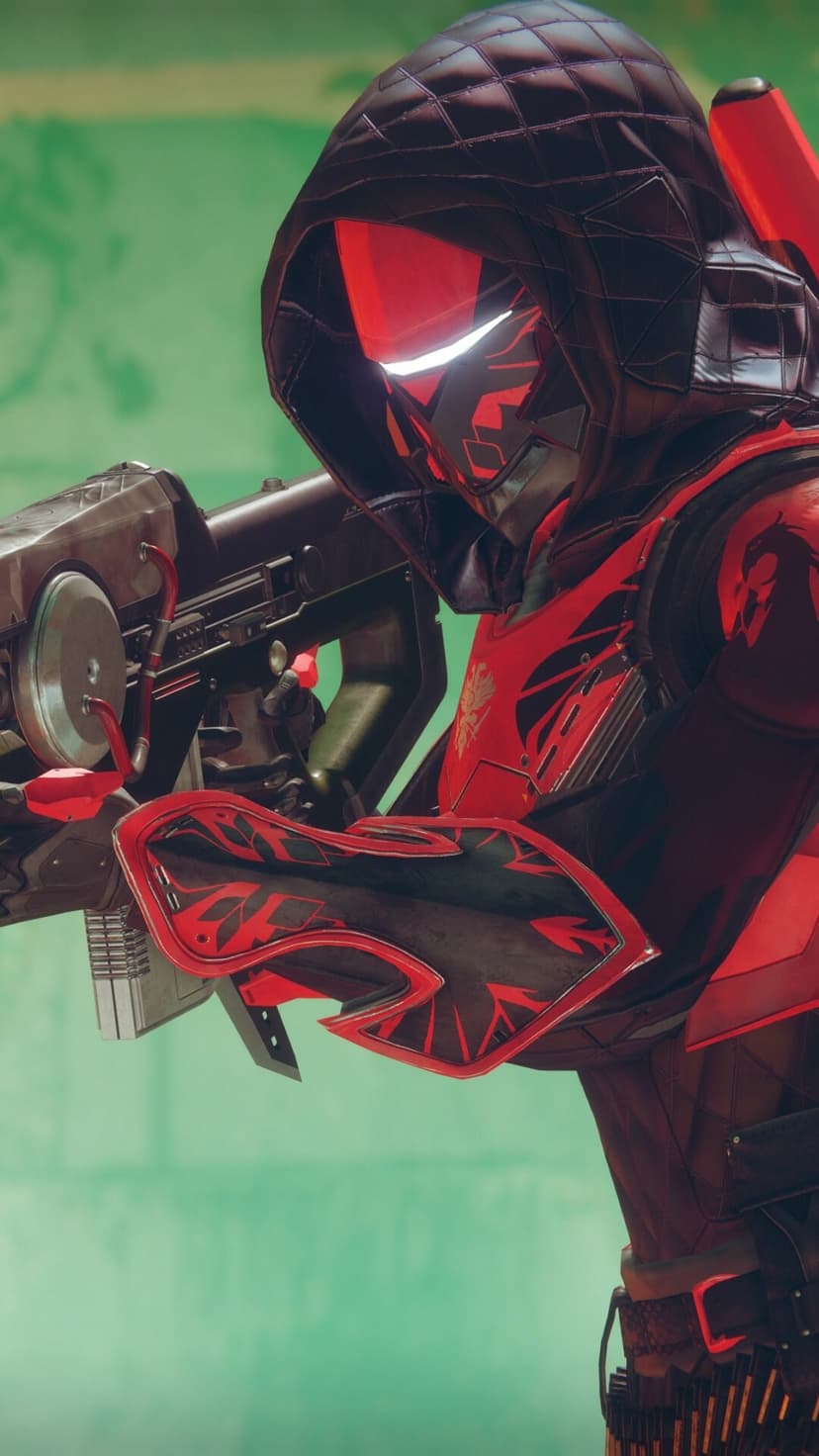 Futuristic soldier in red and black armor with a quilted hood holding a metallic heavy weapon against a teal wall.