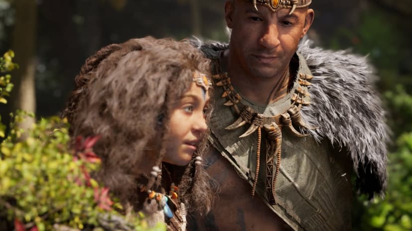 Vin Diesel and a young girl in prehistoric tribal clothing standing in a sunlit jungle with tooth necklaces.