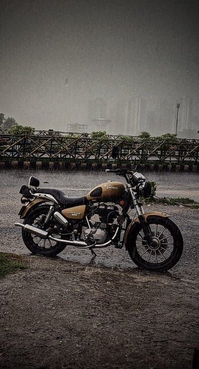 Classic Royal Enfield Bike Rain Portrait Phone Background