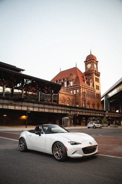 White Mazda MX-5 Miata Phone Wallpaper at Train Station