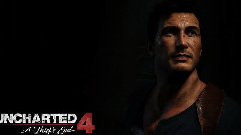Nathan Drake with an intense expression and side-lighting in a dark room with the Uncharted 4 game logo.