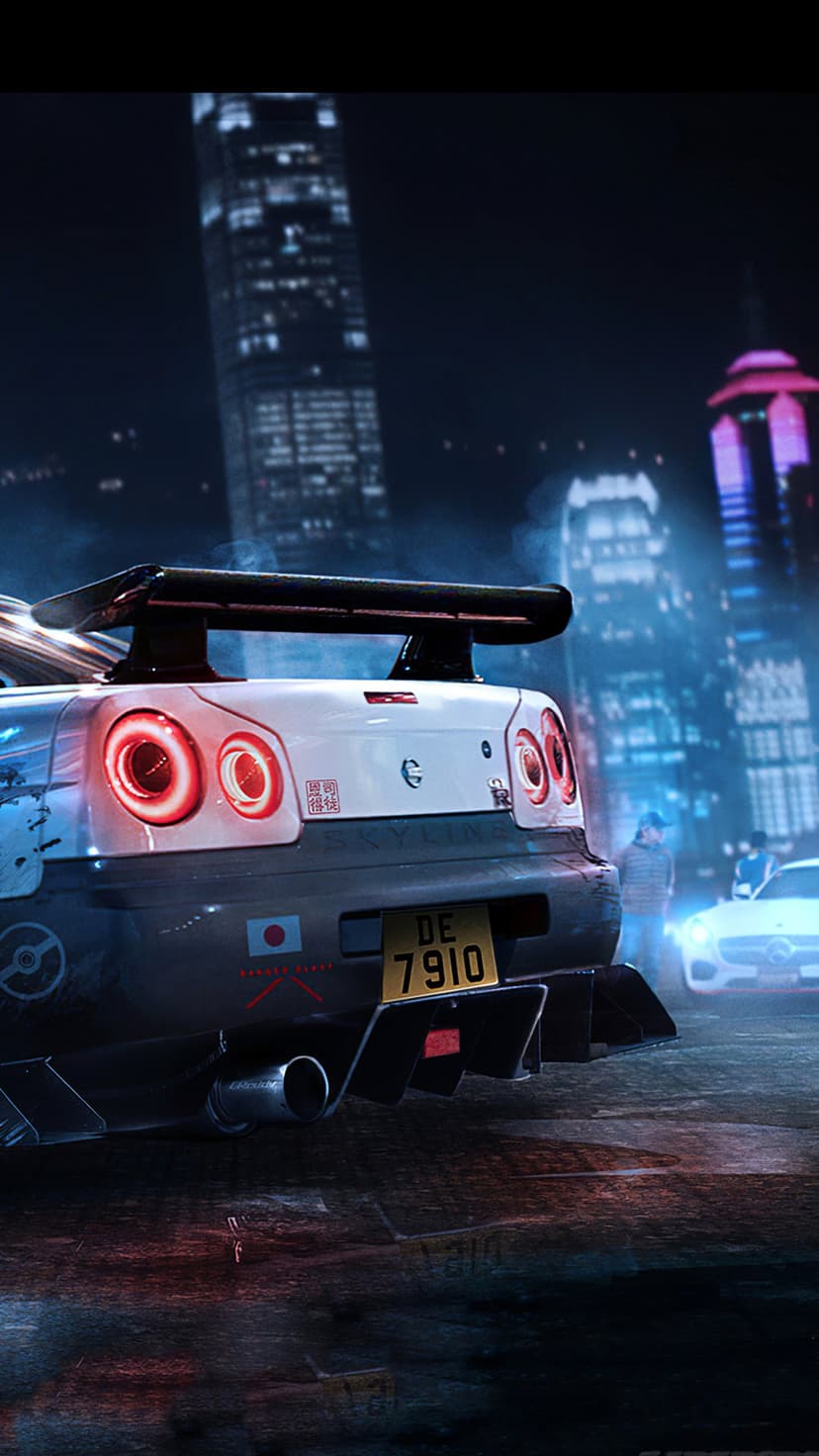 Rear view of a white Nissan Skyline GT-R with red circular tail lights glowing in a neon city at night.