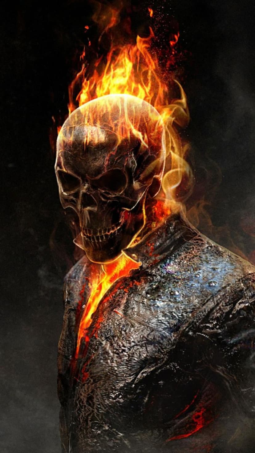 Ghost Rider skull engulfed in bright orange flames with glowing embers against a dark textured background.