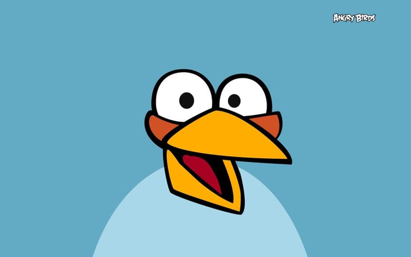 Close-up of the Blue Bird from Angry Birds with wide eyes and an open beak on a flat blue background.
