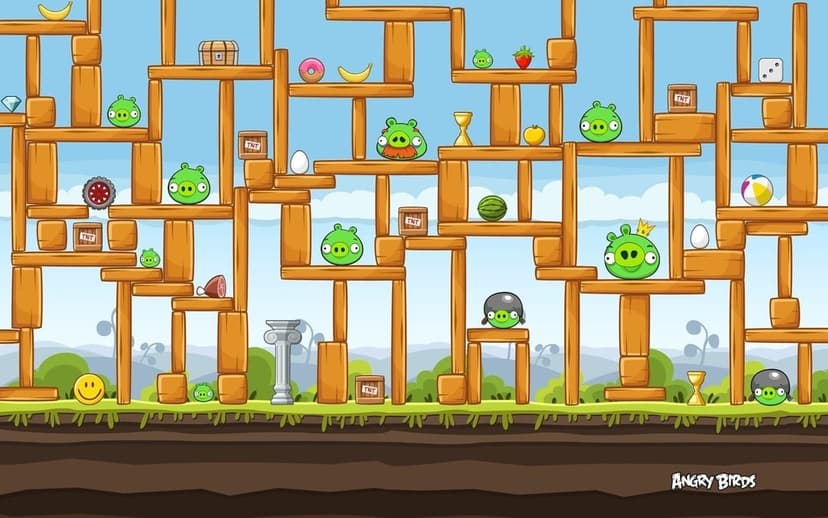 Green pigs and TNT crates inside a large wooden structure against a blue sky in a 2D game level scene.